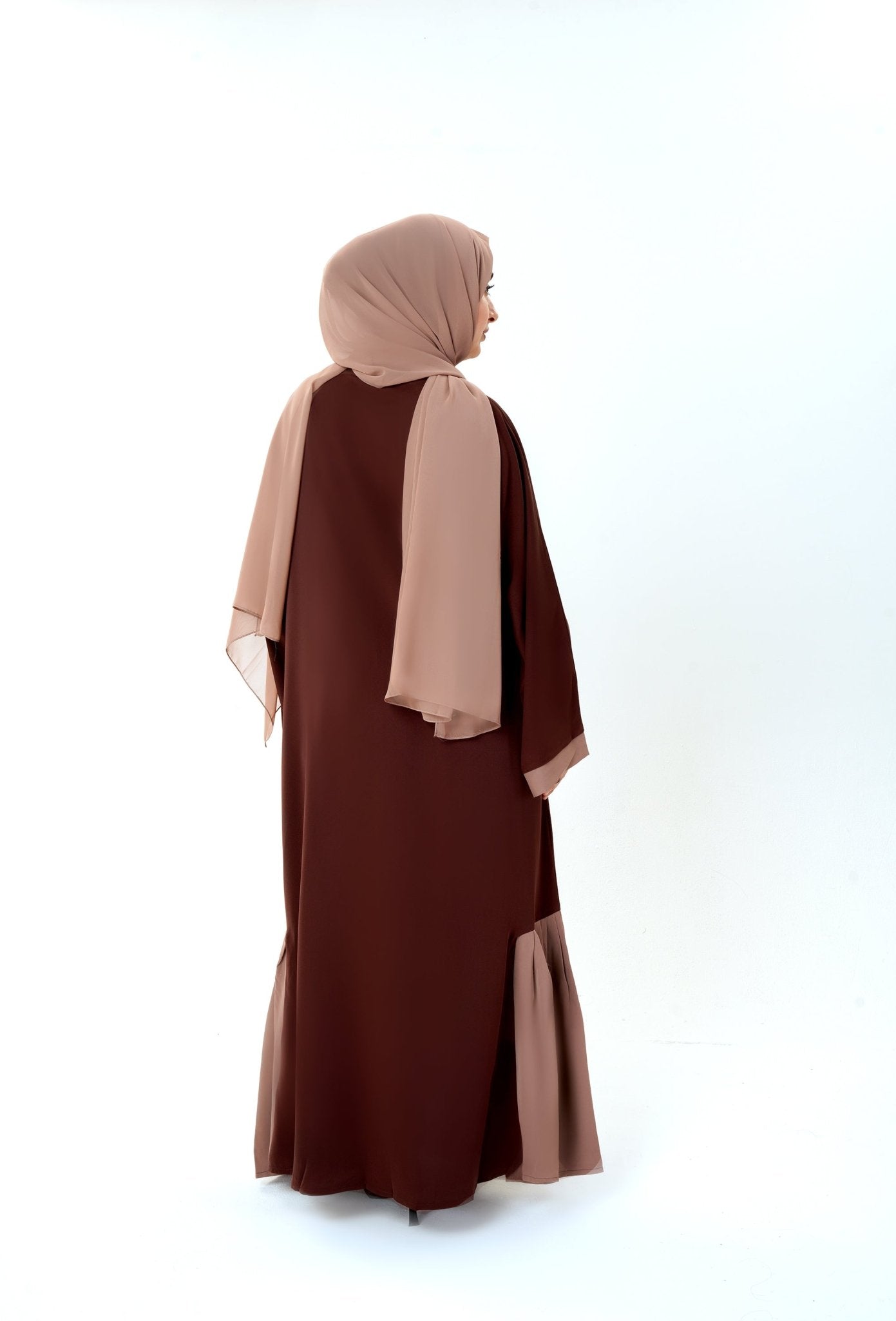 Woman wearing beautiful brown and beige abaya with pockets and matching hijab. Elegant Abaya by MODMOD UK